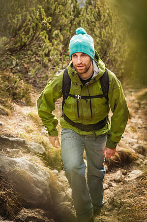 Man hiking in rural landscape Stock Photo - Premium Royalty-Free, Code: 649-09206511