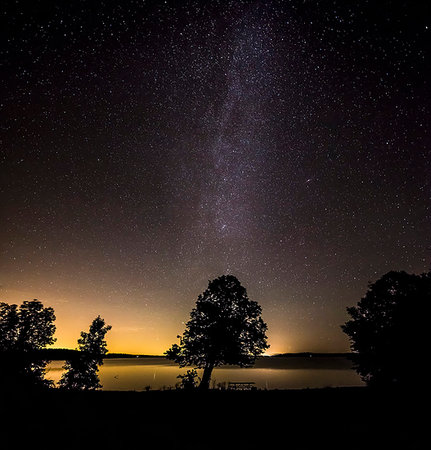 simsearch:6115-08066640,k - Illuminated night sky over rural landscape Stock Photo - Premium Royalty-Free, Code: 649-09206630