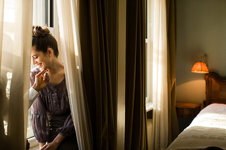 simsearch:614-00808302,k - Affectionate couple on windowsill Stock Photo - Premium Royalty-Free, Code: 649-09206782