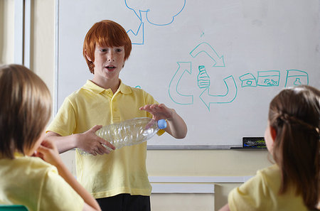 School children discussing recycling issues in classroom Stock Photo - Premium Royalty-Free, Code: 649-09206866