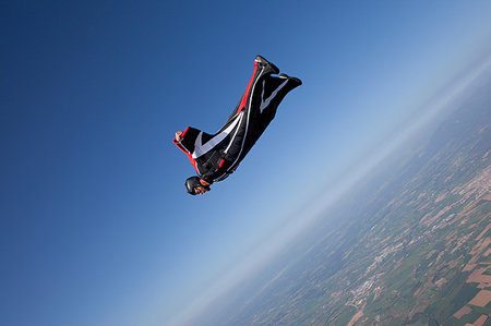 parachute over the blue sky - Man wingsuit flying Stock Photo - Premium Royalty-Free, Code: 649-09206928