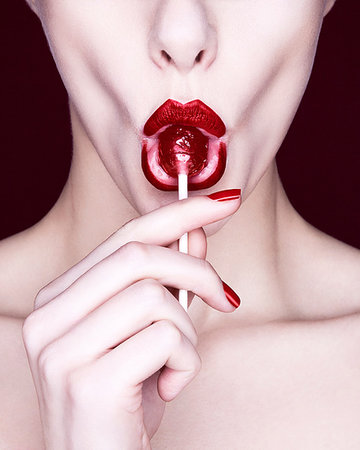 simsearch:649-09207396,k - Woman sucking lollipop Foto de stock - Sin royalties Premium, Código: 649-09206946