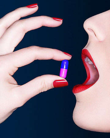 Close up of woman's mouth with bright lipstick and pill Stock Photo - Premium Royalty-Free, Code: 649-09207392