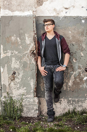 simsearch:695-05768224,k - Teenage boy leaning against wall Stock Photo - Premium Royalty-Free, Code: 649-09207788