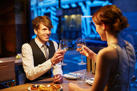 simsearch:649-06000397,k - Couple making a toast in restaurant Stock Photo - Premium Royalty-Free, Code: 649-09208510