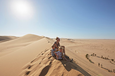 simsearch:649-09035509,k - Mother and sons sitting on sand dune, Dune 7, Namib-Naukluft National Park, Africa Stock Photo - Premium Royalty-Free, Code: 649-09208568