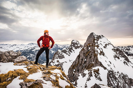 Young hiker standing on mountain range, looking away, Kellenspitze, Tannheim mountains, Tyrol, Austria Stock Photo - Premium Royalty-Free, Code: 649-09208646