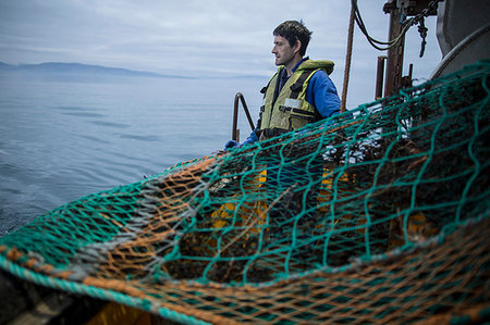 Fisherman preparing net, Isle of Skye, Scotland Stock Photo - Premium Royalty-Free, Code: 649-09208879