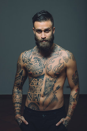 simsearch:649-09212515,k - Portrait of  young man with beard, bare chest covered in tattoos Stock Photo - Premium Royalty-Free, Code: 649-09212516