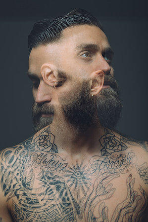 simsearch:649-09212515,k - Multiple exposure of bare chested young man, covered in tattoos, worried, pensive expression Stock Photo - Premium Royalty-Free, Code: 649-09212517