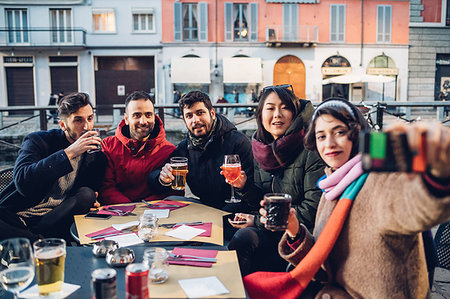 Friends enjoying drink at outdoor cafe, Milan, Italy Stock Photo - Premium Royalty-Free, Code: 649-09212564