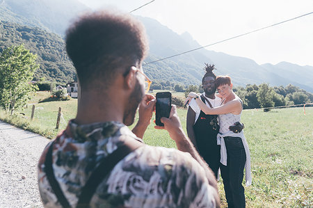 simsearch:649-08702811,k - Young man on rural dirt track photographing friends on smartphone,  Primaluna, Trentino-Alto Adige, Italy Fotografie stock - Premium Royalty-Free, Codice: 649-09213031