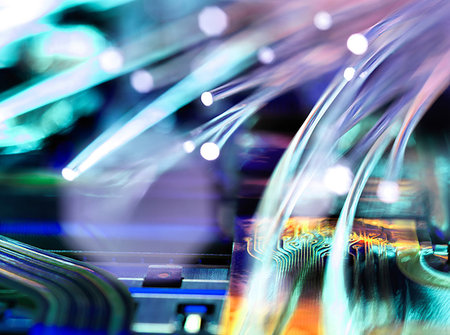 data - Fibre optic strands carrying data over electronic circuit board of laptop computer Stock Photo - Premium Royalty-Free, Code: 649-09213480