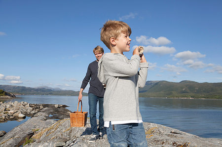 simsearch:649-09138976,k - Boy and father carrying basket over inlet rock, Aure, More og Romsdal, Norway Stock Photo - Premium Royalty-Free, Code: 649-09213643