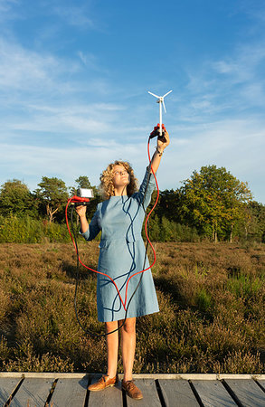 future optimistic - Teenage girl powering LED light using miniature wind turbine, Netherlands Stock Photo - Premium Royalty-Free, Code: 649-09230120