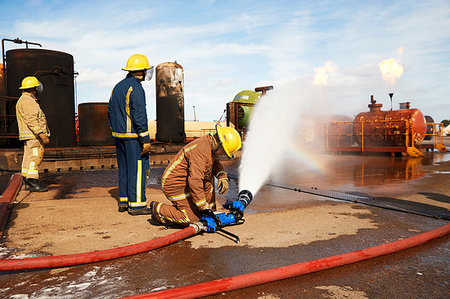 Firemen training to put out fire on burning tanks, Darlington, UK Photographie de stock - Premium Libres de Droits, Code: 649-09230468