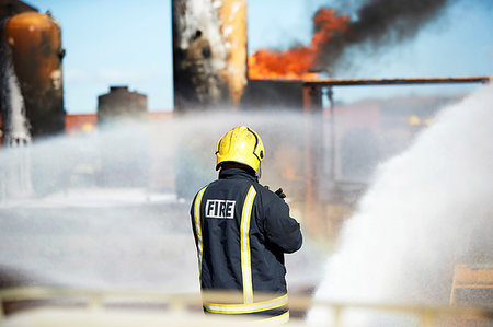 firefighters spray water - Fireman training to put out fire on burning tanks, Darlington, UK Stock Photo - Premium Royalty-Free, Code: 649-09230492