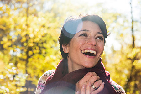 simsearch:649-09025835,k - Smiling woman in autumnal forest Stock Photo - Premium Royalty-Free, Code: 649-09245715