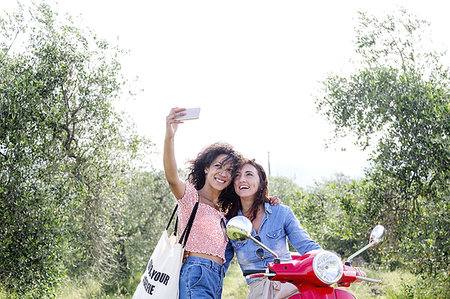 Friends taking selfie in olive grove, Città della Pieve, Umbria, Italy Stock Photo - Premium Royalty-Free, Code: 649-09245738