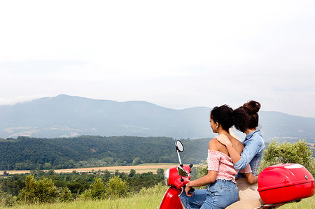 Friends exploring on scooter, Città della Pieve, Umbria, Italy Stock Photo - Premium Royalty-Free, Code: 649-09245749