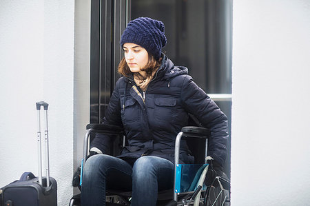 simsearch:649-07437435,k - Woman in wheelchair with luggage Stock Photo - Premium Royalty-Free, Code: 649-09245801