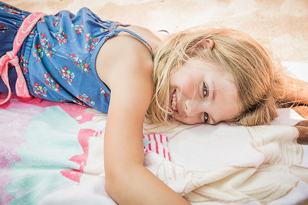 Girl lying on beach towel, portrait, Los Angeles, USA Stock Photo - Premium Royalty-Free, Code: 649-09245831