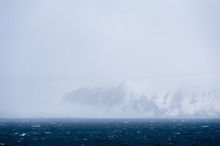 Arctic ocean and snowy coastal landscape, Wahlenberg fjord, Nordaustlandet, Svalbard, Norway. Stock Photo - Premium Royalty-Free, Code: 649-09246140