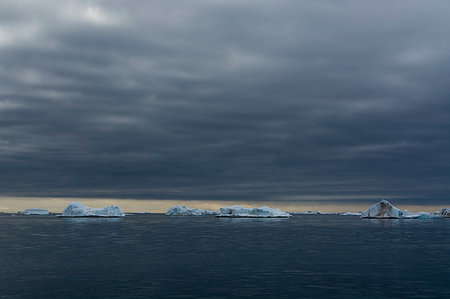 Icebergs under cloudy sky, Vibebukta, Austfonna, Nordaustlandet, Svalbard, Norway Stock Photo - Premium Royalty-Free, Code: 649-09246162