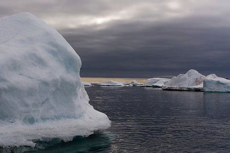 Seascape with icebergs, Vibebukta, Austfonna, Nordaustlandet, Svalbard, Norway Stock Photo - Premium Royalty-Free, Code: 649-09246176