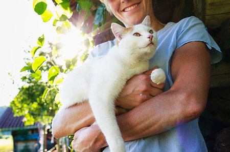 simsearch:649-09208838,k - Woman carrying cat in countryside Stock Photo - Premium Royalty-Free, Code: 649-09246358