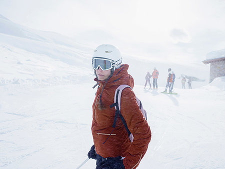 simsearch:649-08118770,k - Young female skier wearing helmet and ski goggles on ski slope,  Alpe Ciamporino, Piemonte, Italy Photographie de stock - Premium Libres de Droits, Code: 649-09246572