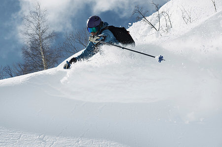 simsearch:649-07280230,k - Male skier skiing on powder snow, Alpe-d'Huez, Rhone-Alpes, France Photographie de stock - Premium Libres de Droits, Code: 649-09246612