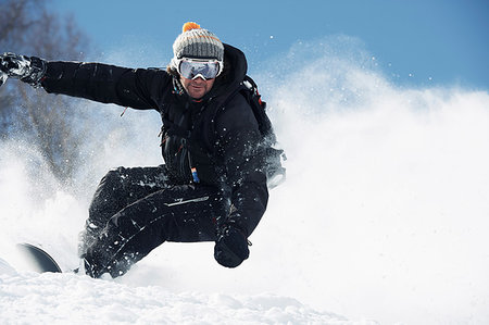 simsearch:649-09258452,k - Male snowboarder speeding down mountainside, Alpe-d'Huez, Rhone-Alpes, France Stock Photo - Premium Royalty-Free, Code: 649-09246643
