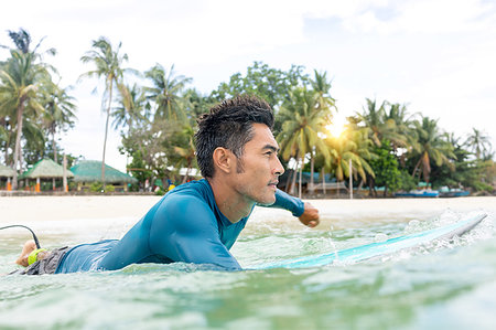 Surfer waiting in sea, Pagudpud, Ilocos Norte, Philippines Stock Photo - Premium Royalty-Free, Code: 649-09246755