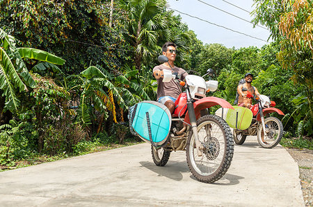 simsearch:614-09259136,k - Motorcyclists carrying surfboard on bike, Pagudpud, Ilocos Norte, Philippines Fotografie stock - Premium Royalty-Free, Codice: 649-09246765