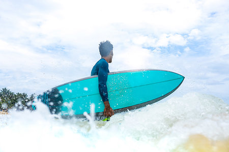 Surfer in action, Pagudpud, Ilocos Norte, Philippines Stock Photo - Premium Royalty-Free, Code: 649-09246762
