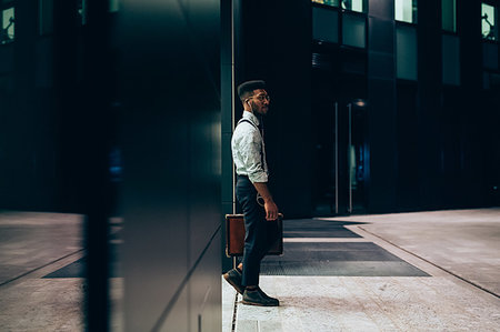 Businessman leaving office building, Milano, Lombardia, Italy Stock Photo - Premium Royalty-Free, Code: 649-09257427