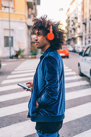 Young man exploring city, Milano, Lombardia, Italy Stock Photo - Premium Royalty-Free, Code: 649-09257658