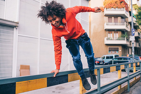 simsearch:649-09257665,k - Young man jumping over divider on pavement, Milano, Lombardia, Italy Stockbilder - Premium RF Lizenzfrei, Bildnummer: 649-09257678