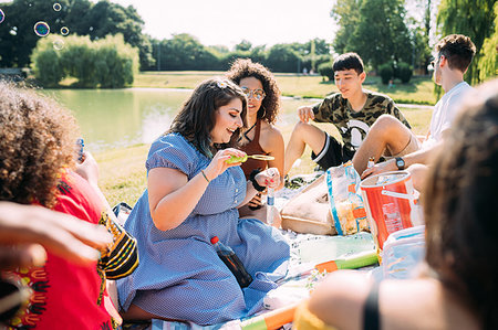 simsearch:649-08949687,k - Group of friends relaxing at picnic in park Stock Photo - Premium Royalty-Free, Code: 649-09257740