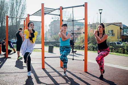 simsearch:649-08577265,k - Calisthenics class at outdoor gym, young women balancing on one leg Stock Photo - Premium Royalty-Free, Code: 649-09257992