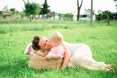 simsearch:614-09245254,k - Mother lying on grass gazing at toddler daughter, Arezzo, Tuscany, Italy Stock Photo - Premium Royalty-Free, Code: 649-09258025