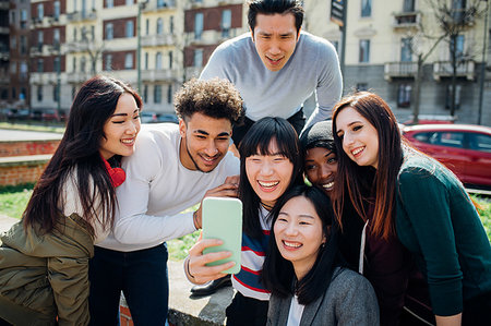 simsearch:649-08702811,k - Young male and female adult friends taking smartphone selfie near city street Stock Photo - Premium Royalty-Free, Code: 649-09258095