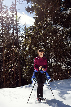 snowshoer (female) - Teenage girl snowshoeing in snow covered mountain forest, portrait, Styria, Tyrol, Austria Stock Photo - Premium Royalty-Free, Code: 649-09258165