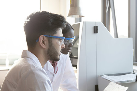 drugs results - Young female and male scientists looking at results in laboratory Stock Photo - Premium Royalty-Free, Code: 649-09258373