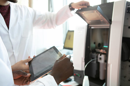 drugs results - Young female and male scientists using digital tablet in laboratory, mid section Stock Photo - Premium Royalty-Free, Code: 649-09258383