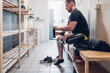 Man with prosthetic leg in gym changing room Stock Photo - Premium Royalty-Free, Code: 649-09250686