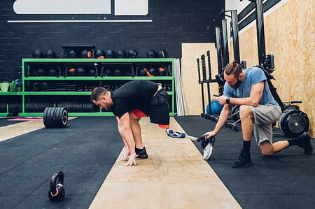 Man with prosthetic leg training in gym Stock Photo - Premium Royalty-Free, Code: 649-09250691