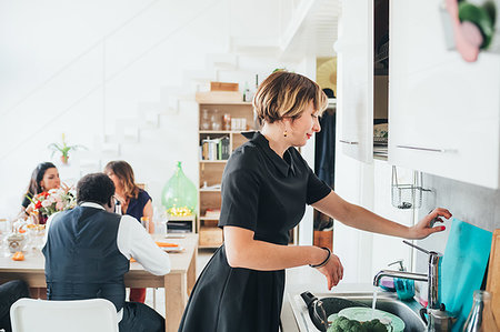 Businessmen and businesswomen on lunch break in loft office Stock Photo - Premium Royalty-Free, Code: 649-09251071