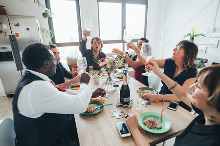 simsearch:614-08877808,k - Businessmen and businesswomen celebrating at lunch party in loft office Stock Photo - Premium Royalty-Free, Code: 649-09251148